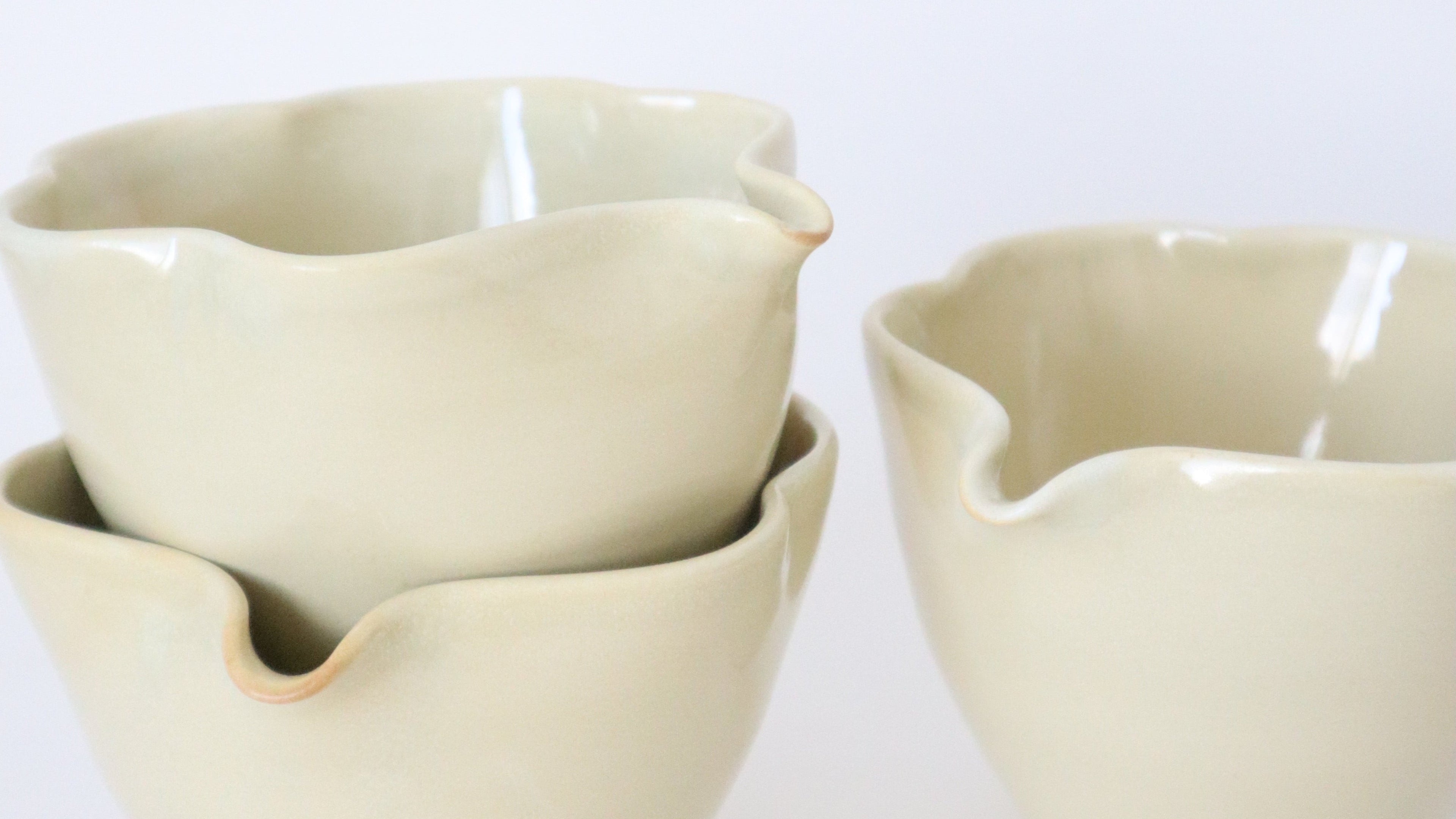 yellow ceramic cup on a white background