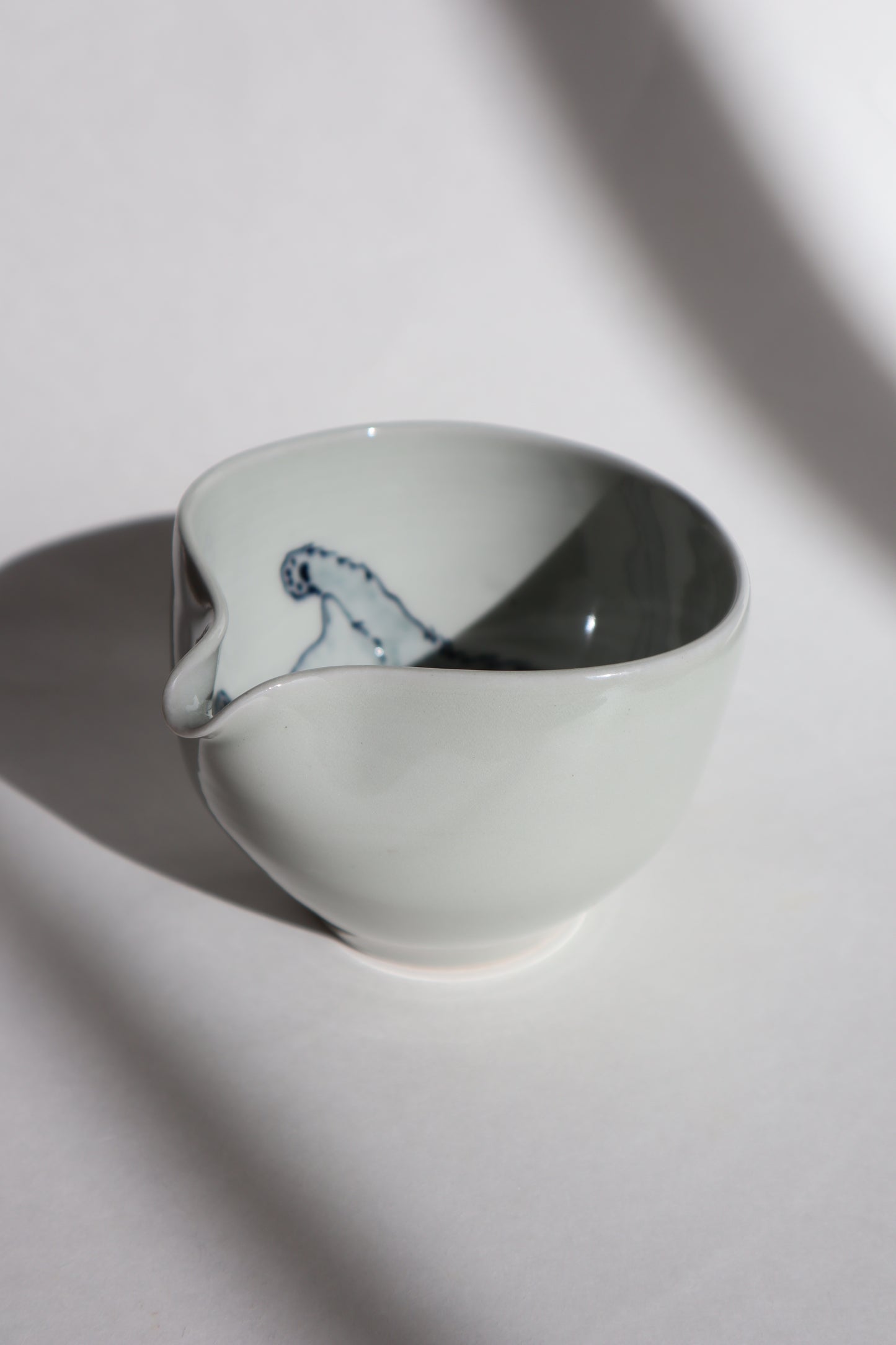 Boo the cat in matcha bowl