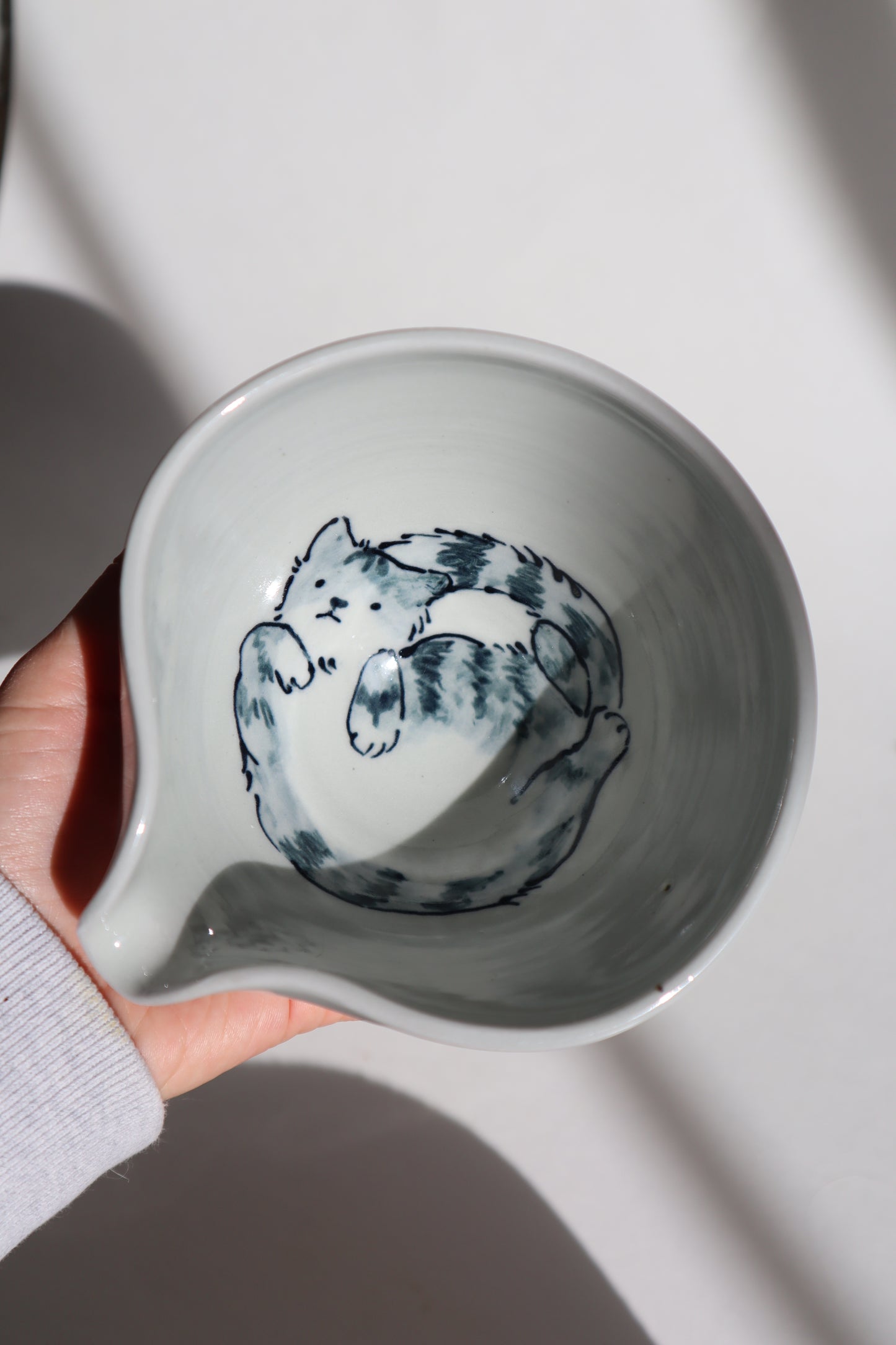 Harry the cat in matcha bowl