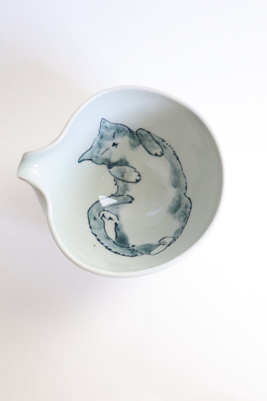 Sleepy the cat in matcha bowl