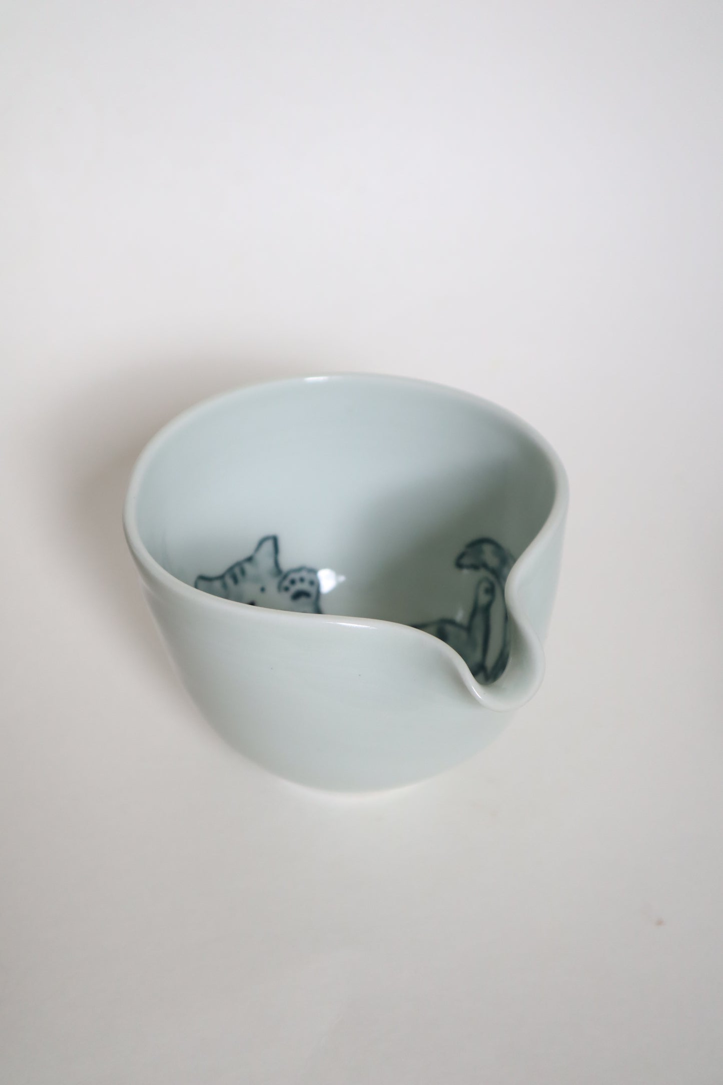 Button the cat in matcha bowl