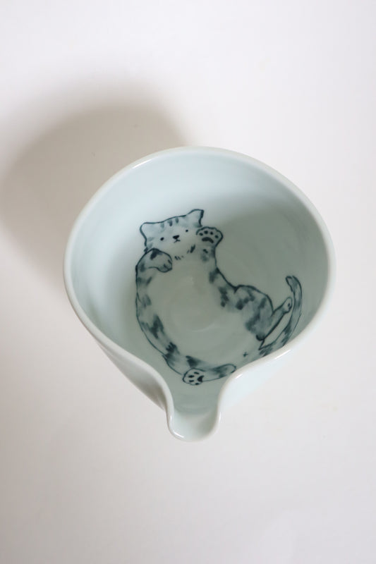 Button the cat in matcha bowl