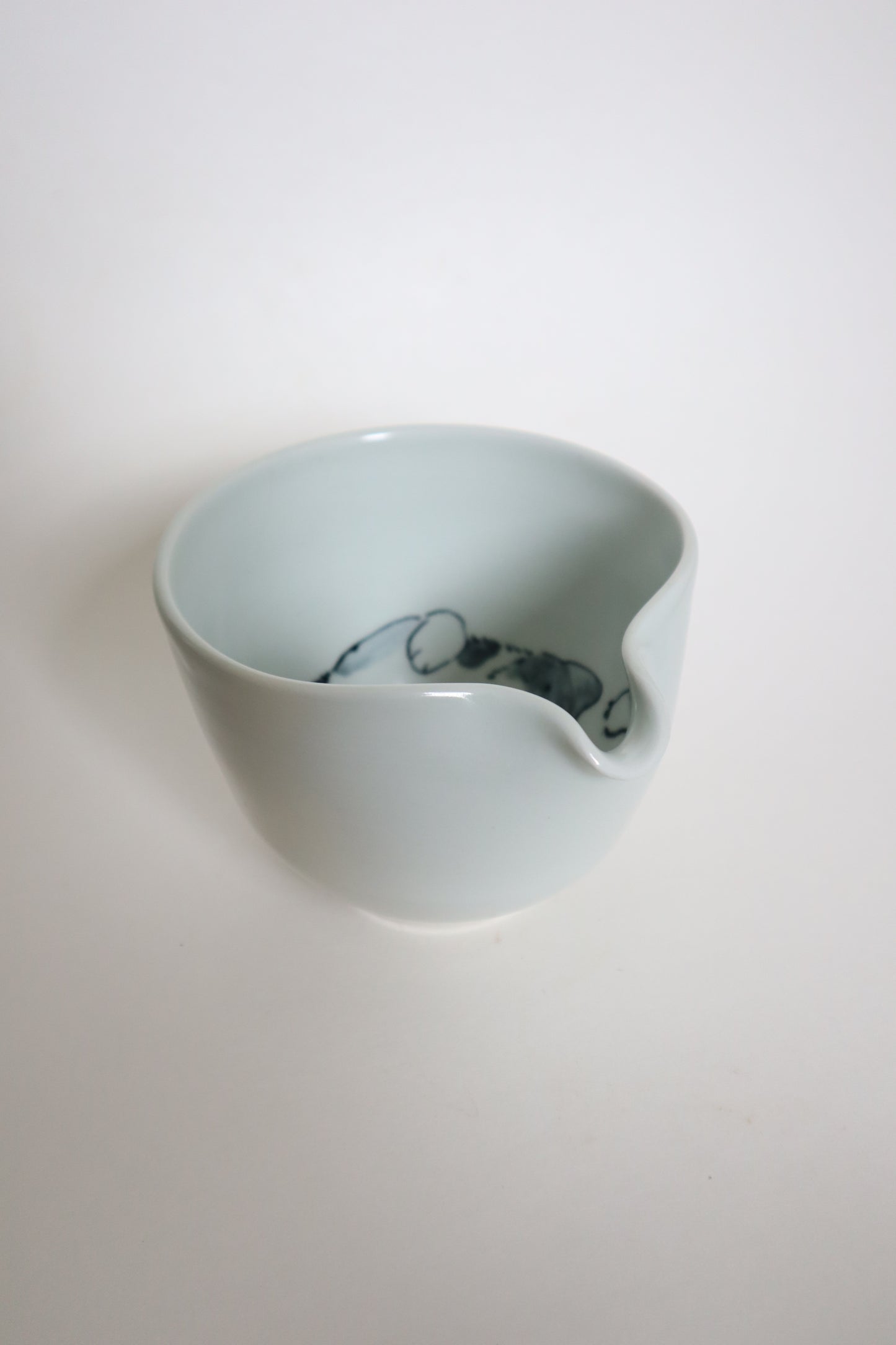 Zigzag the cat in matcha bowl